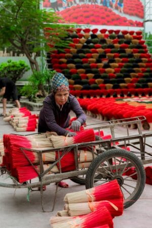 People are drying incense sticks in Quang Phu Cau incense village.