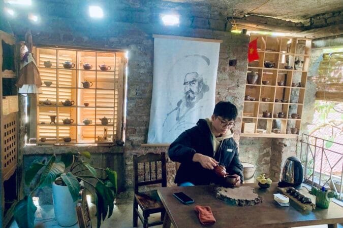 Enjoying tea at the pottery workshop at Bat Trang village.