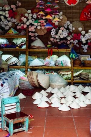 A display space showcasing hat products from artisan Ta Thu Huong.