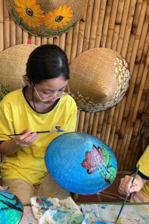 Experience making non la- conical hats in Chuong village.