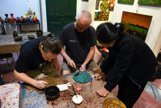 Handmade lacquer art during a tour to Ha Thai village.