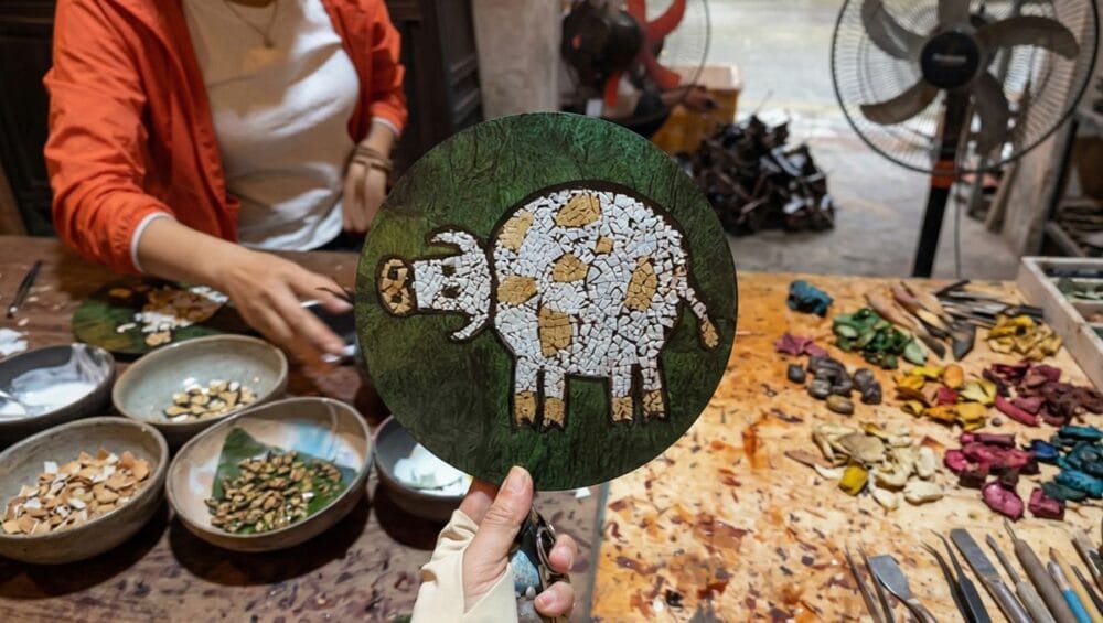 The colorful handcrafted lacquer paintings at Ha Thai lacquer village are a must-see destination in ha thai lacquer village tour