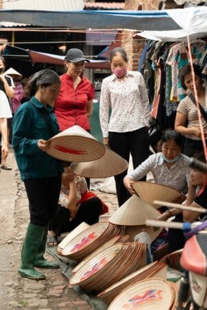The finished conical hats are brought to the Chuong village market for sale