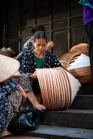 The finished conical hats are brought to the Chuong village market for sale.