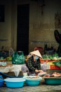 The local market in Chuong conical hat village